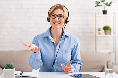 Support consultant. Professional woman communicates with client with headset